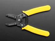 Multi-size wire stripper & cutter