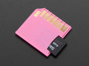 Pink Shortening microSD card adapter for Raspberry Pi & Macbooks